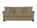 Beige Sofa With Nail Head Trim And Throw Pillows