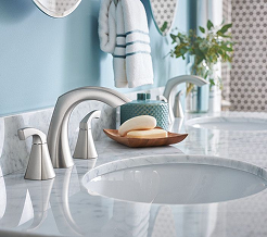 Stainless steel facet with a marble vanity top.