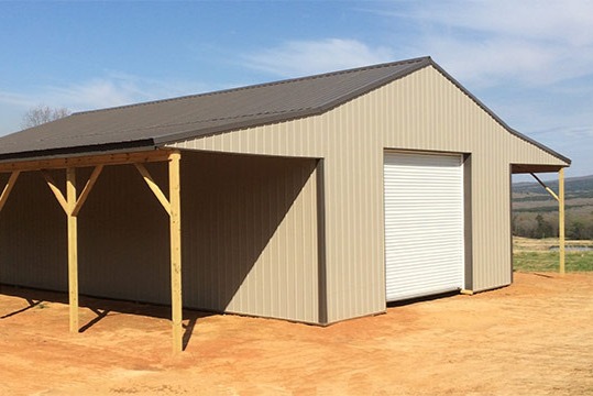 Tan and brown horse barn.