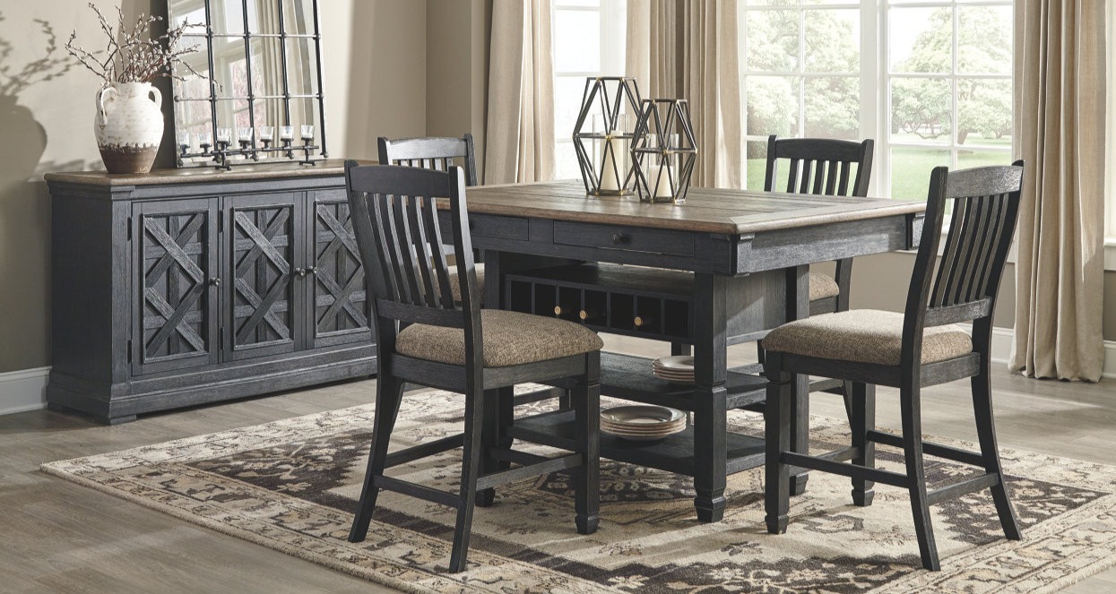 Dark wood dining table with matching counter height chairs. 